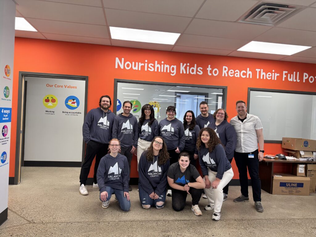 The Avalanche team together volunteering at Kids' Food Basket
